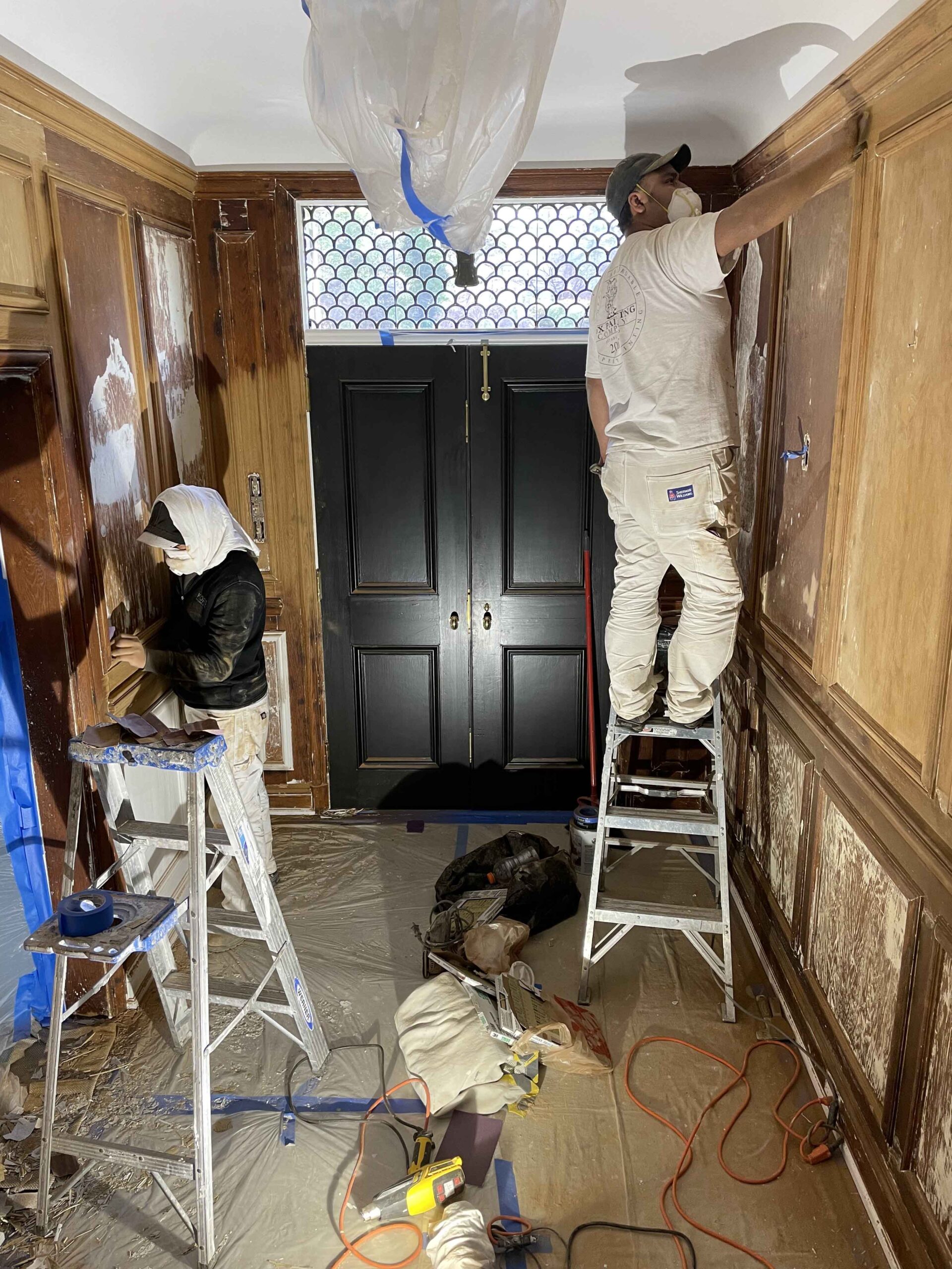 Fox Painting Company team members preparing to paint a home’s interior