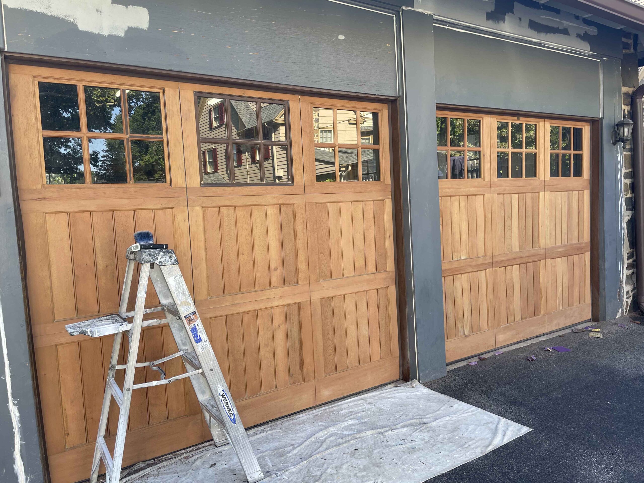 Wood garage doors before they were stained.